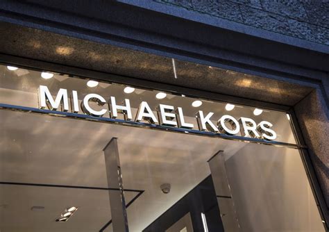 michael kors stock buy or sell|capri holdings news.